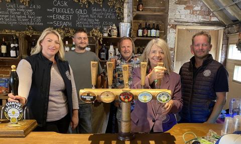 Harriett Baldwin MP pours a pint at the Tap Room at Spilsbury and Jones